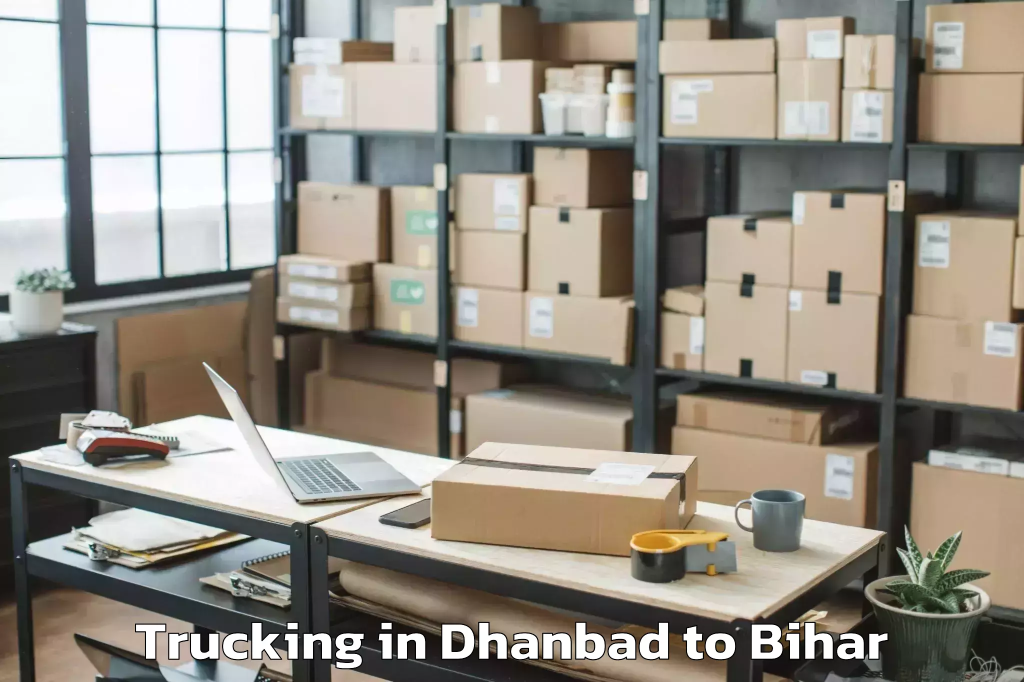 Easy Dhanbad to Ghanshampur Trucking Booking